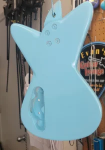 Guitar back painted with background blue. Next is to add paint design